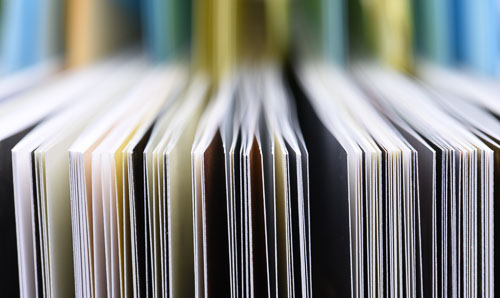 A close-up of pages of a book with lots of bokeh.