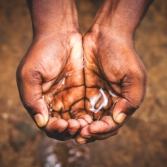 man with water in hands