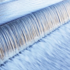 water flowing down a dam
