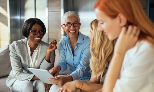 Group of business women talking and laughing